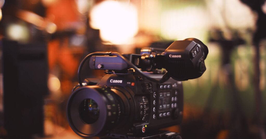 Close-up of a professional video camera with selective focus in a studio setting.